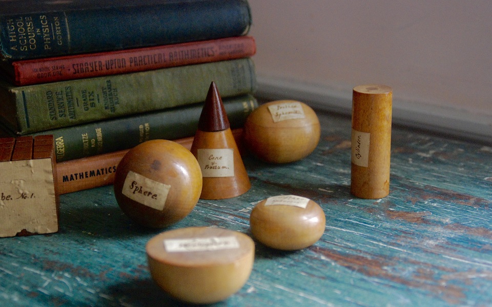 Books with a models of a cone, sphere and cylinder